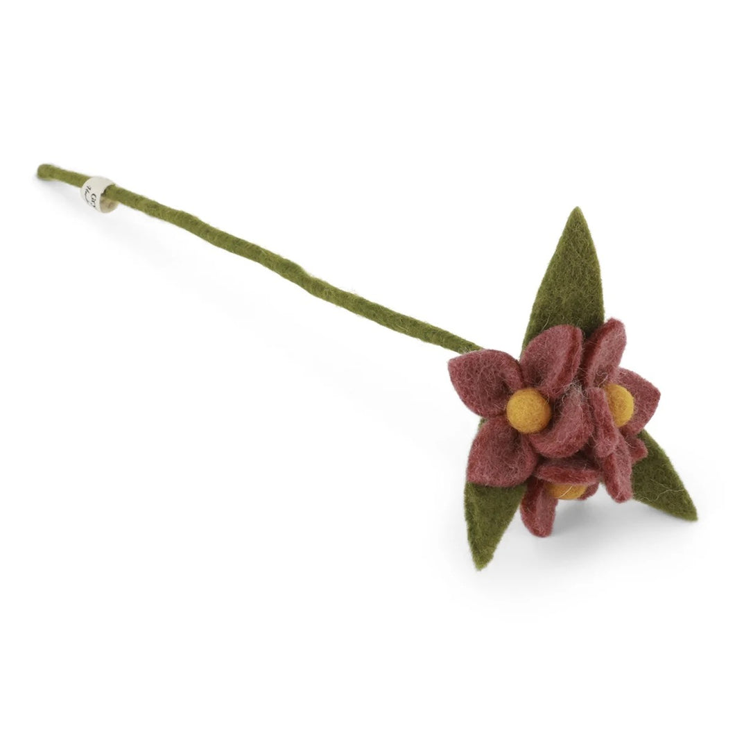 Tak met rode bloemen