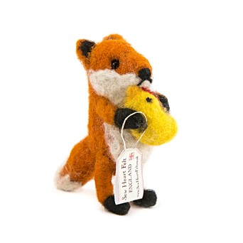 Baby fox with cuddly toy